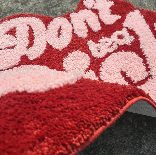 Don’t be a d*ck rug